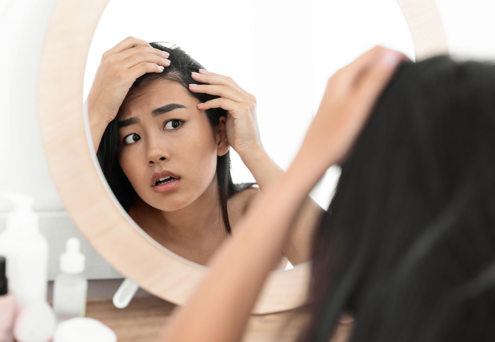 woman worried about Crohn&rsquo;s disease hair loss